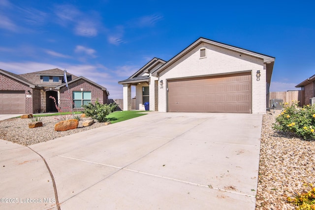 2933 Abbeville Ave, Wolfforth, TX 79382 - ranch-style house featuring brick siding, an attached garage, and concrete driveway