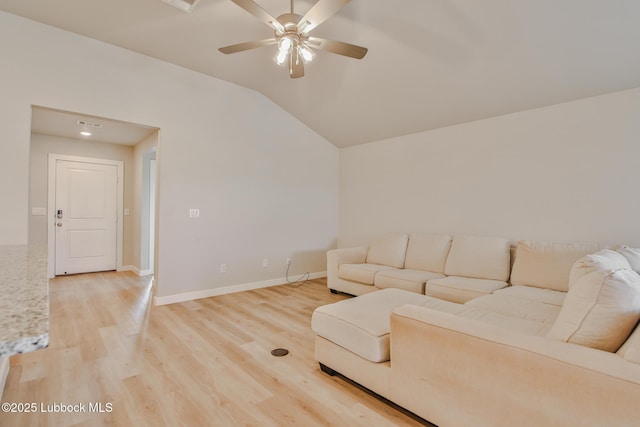 2933 Abbeville Ave, Wolfforth, TX 79382 - living area featuring light wood finished floors, ceiling fan, and vaulted ceiling