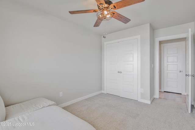 2933 Abbeville Ave, Wolfforth, TX 79382 - bedroom featuring carpet floors, a closet, and ceiling fan
