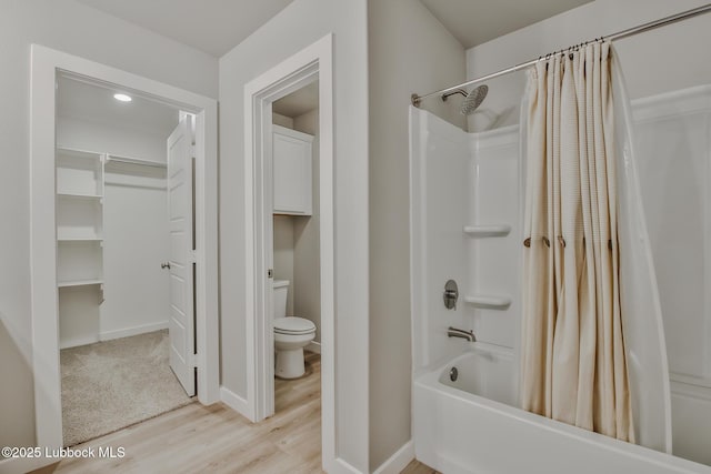 2933 Abbeville Ave, Wolfforth, TX 79382 - full bathroom with shower / bath combination with curtain and wood finished floors