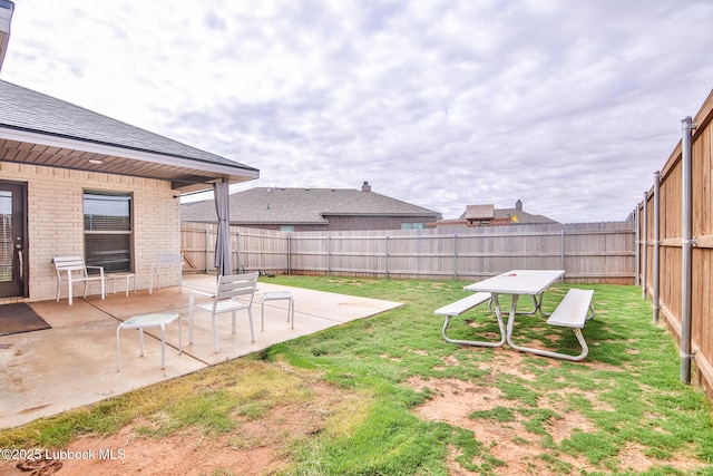 2933 Abbeville Ave, Wolfforth, TX 79382 - fenced backyard with a patio