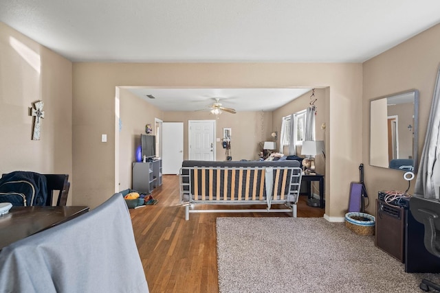 bedroom with wood-type flooring and ceiling fan