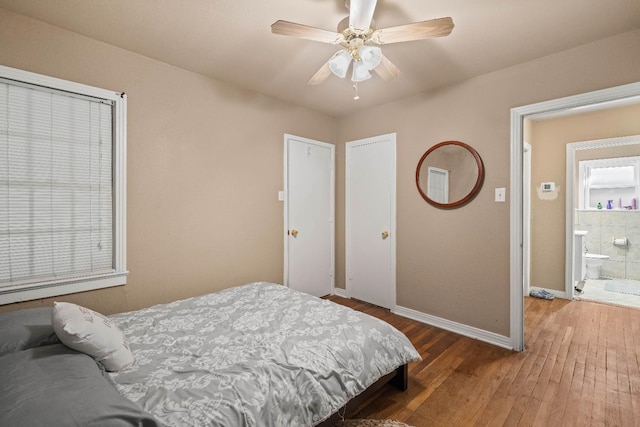 bedroom with hardwood / wood-style floors and ceiling fan