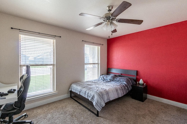 carpeted bedroom with ceiling fan