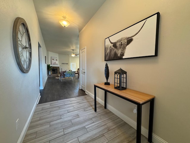 hall with light hardwood / wood-style floors