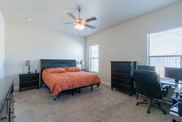 bedroom featuring light carpet and ceiling fan