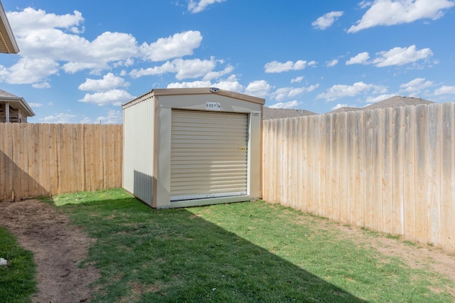 view of outdoor structure featuring a lawn