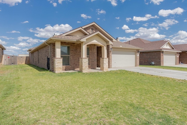 view of front of house featuring a garage and a front yard