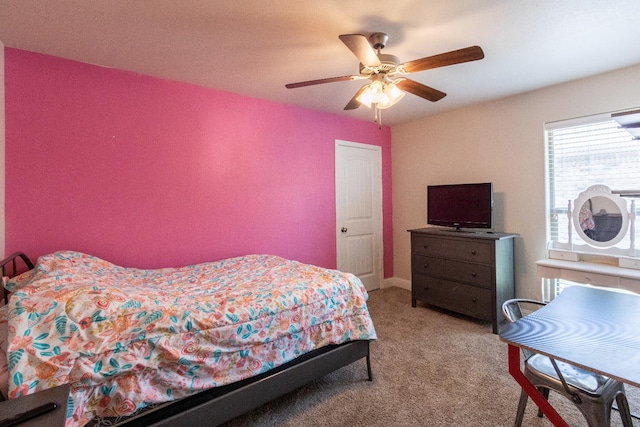 carpeted bedroom featuring ceiling fan