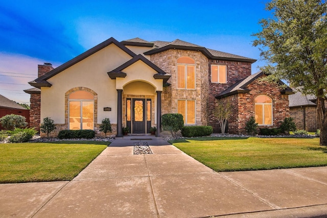 view of front of home with a yard