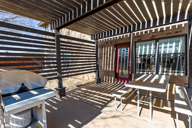 view of patio / terrace with a grill and a pergola