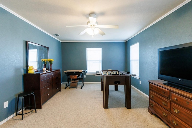 rec room featuring crown molding, light carpet, and ceiling fan