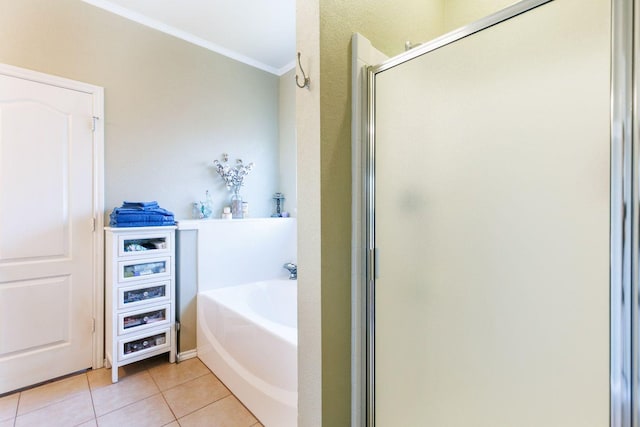 bathroom featuring crown molding, shower with separate bathtub, and tile patterned flooring