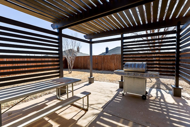 view of patio featuring grilling area and a pergola