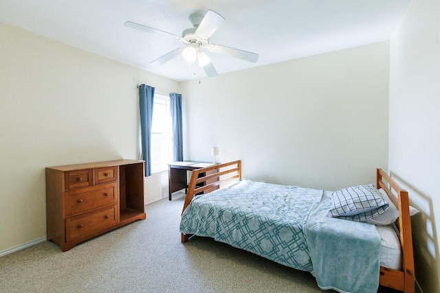 bedroom featuring ceiling fan and light colored carpet