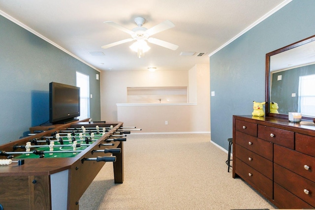 playroom featuring ornamental molding, plenty of natural light, light carpet, and ceiling fan