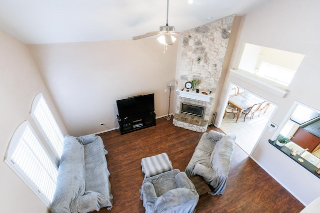 living room featuring dark wood-type flooring and high vaulted ceiling