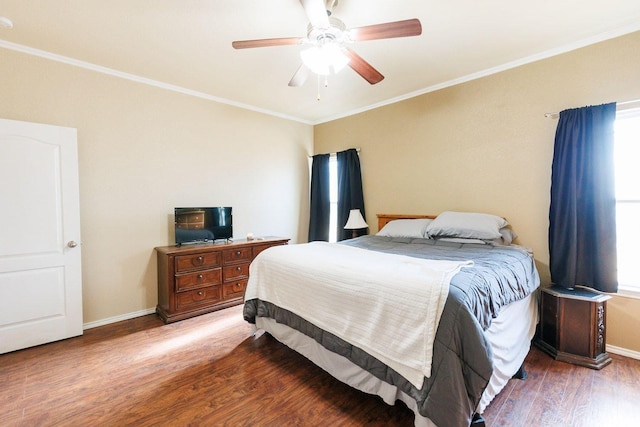 bedroom with wood-type flooring, crown molding, and ceiling fan