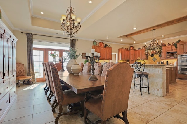 tiled dining space featuring crown molding, a tray ceiling, french doors, and a chandelier