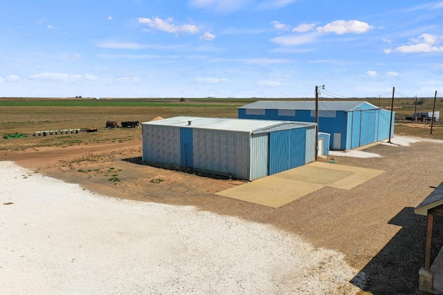 view of outbuilding with a rural view