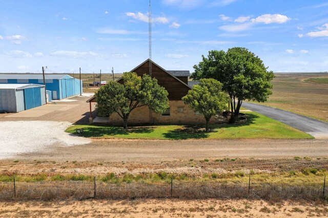 view of front of house featuring a rural view