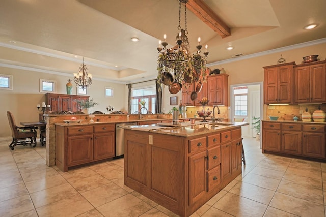 kitchen with pendant lighting, dishwasher, a kitchen island with sink, and decorative backsplash