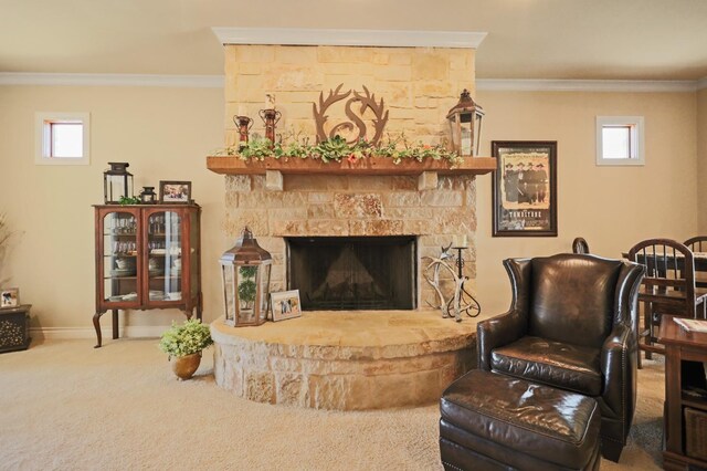 living area featuring a fireplace, ornamental molding, and carpet