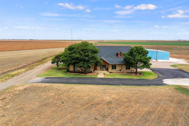 view of front of home with a rural view and a garage