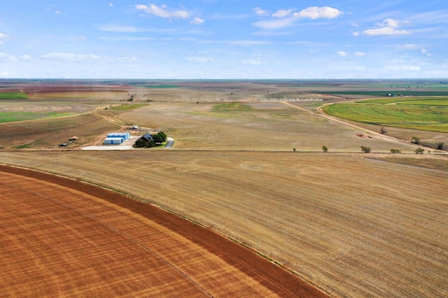 birds eye view of property with a rural view