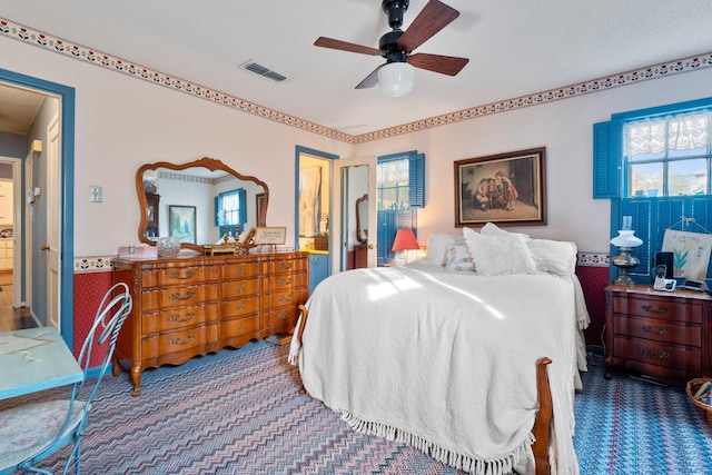 bedroom featuring ceiling fan and carpet flooring