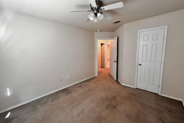 unfurnished bedroom featuring carpet and ceiling fan