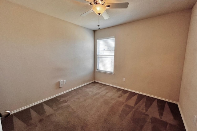 unfurnished room featuring ceiling fan and carpet flooring