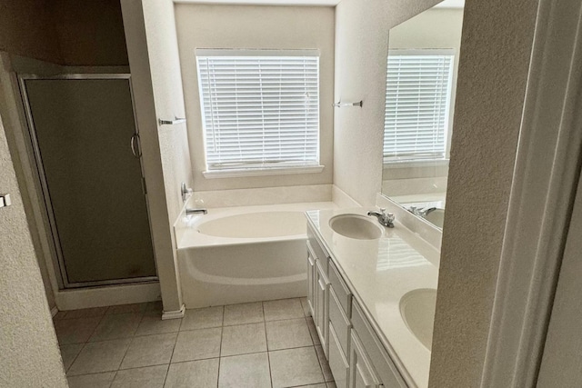 bathroom with tile patterned flooring, vanity, and independent shower and bath