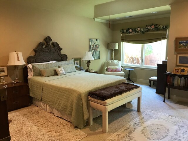 3909 101st St, Lubbock, TX 79423 - bedroom with baseboards, ornamental molding, and light carpet