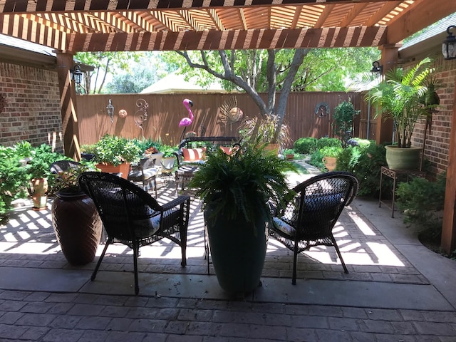 3909 101st St, Lubbock, TX 79423 - view of patio / terrace featuring a fenced backyard and a pergola