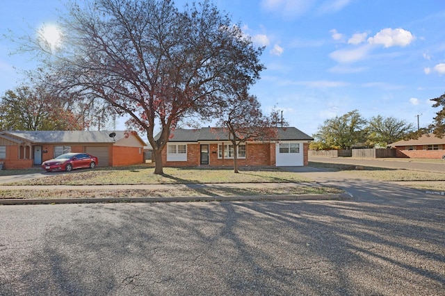 single story home featuring a garage