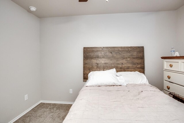 unfurnished bedroom featuring ceiling fan and carpet flooring