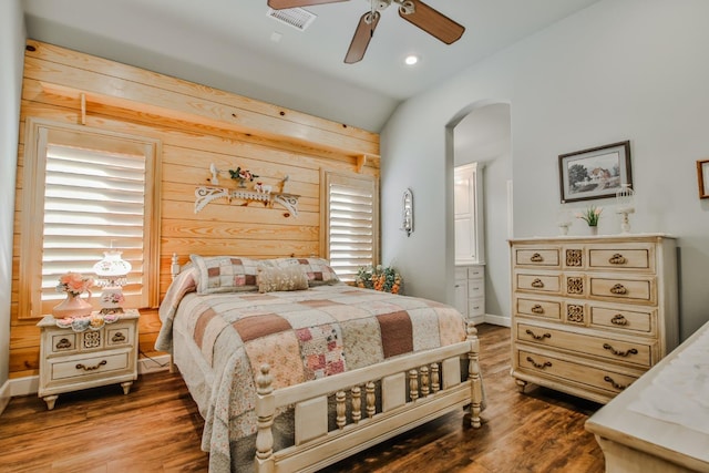 bedroom featuring lofted ceiling, wood-type flooring, and ceiling fan