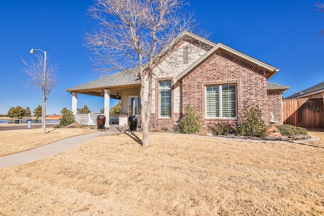 view of property featuring covered porch