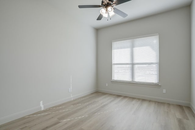 spare room with ceiling fan and light hardwood / wood-style flooring