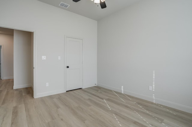 unfurnished bedroom with ceiling fan and light wood-type flooring