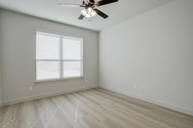 empty room with ceiling fan and light wood-type flooring