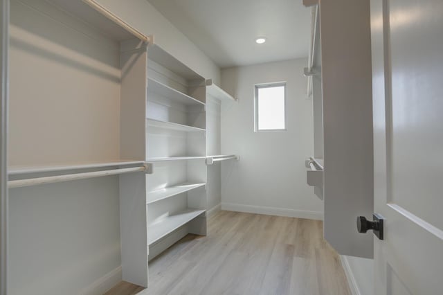 walk in closet featuring light wood-type flooring