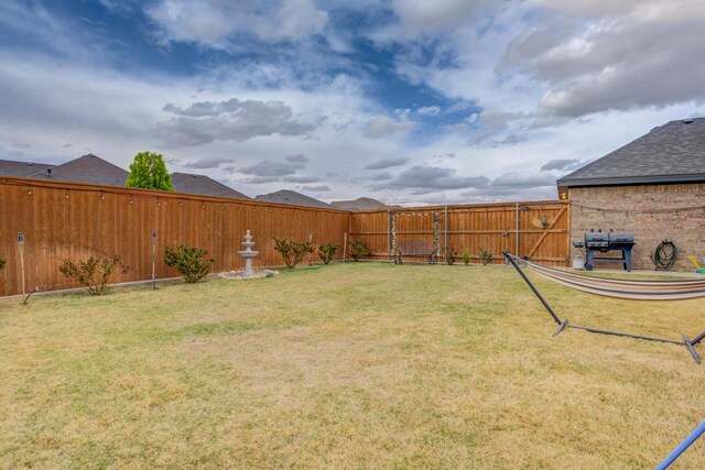 view of yard featuring a fenced backyard