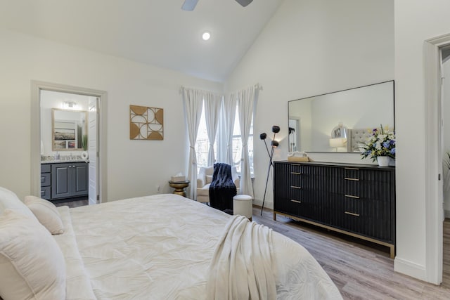bedroom featuring recessed lighting, connected bathroom, high vaulted ceiling, baseboards, and wood finished floors