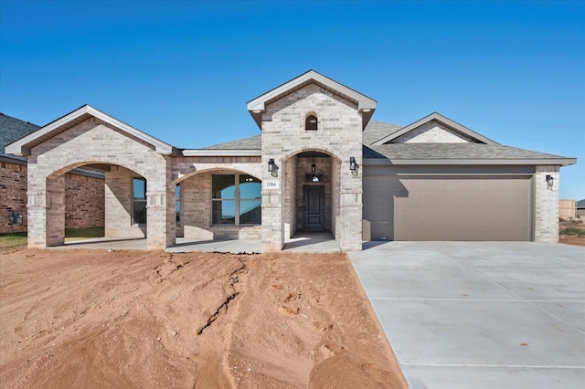 1204 E 31st St, Wolfforth, TX 79382 - view of front of property featuring a garage
