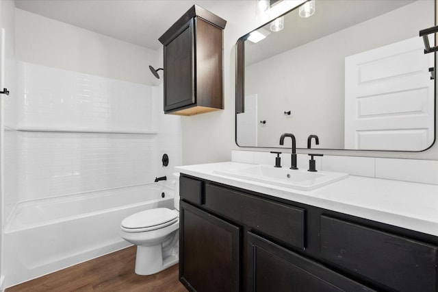 1204 E 31st St, Wolfforth, TX 79382 - full bathroom featuring tiled shower / bath, hardwood / wood-style floors, vanity, and toilet