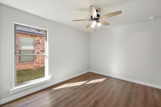 1204 E 31st St, Wolfforth, TX 79382 - spare room with dark hardwood / wood-style flooring and ceiling fan
