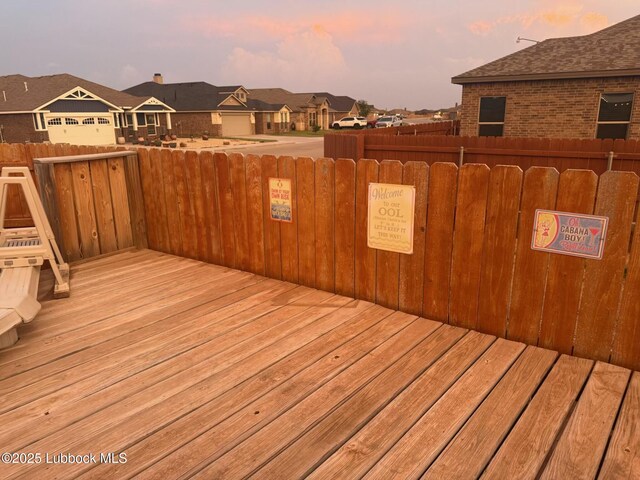 7501 100th St, Lubbock, TX 79424 - deck at dusk with a residential view