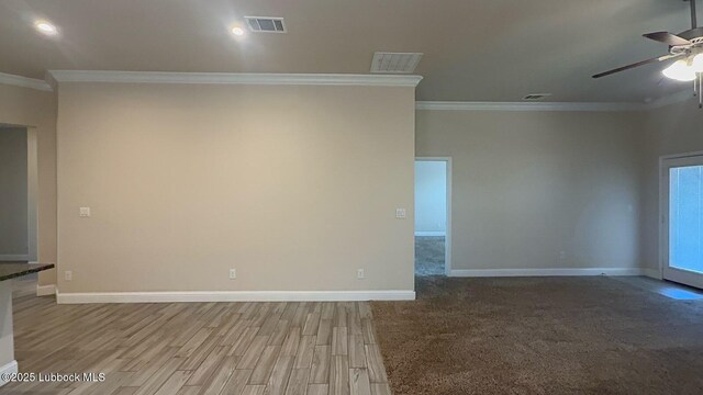 7501 100th St, Lubbock, TX 79424 - unfurnished room with ornamental molding, a ceiling fan, and wood finished floors
